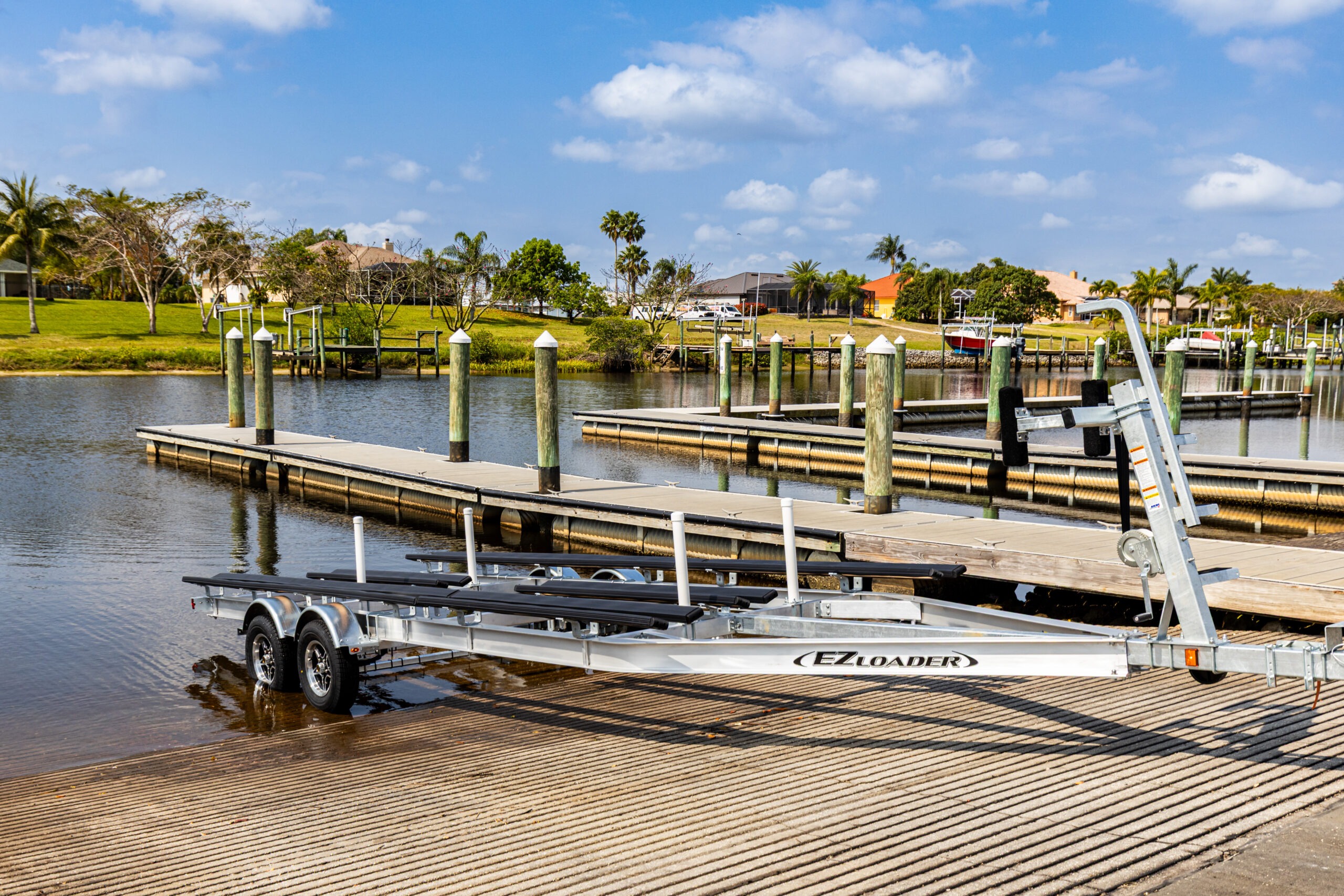 EZ Loader tandem axle aluminum boat trailer with bunk support, ideal for secure and corrosion-resistant towing.