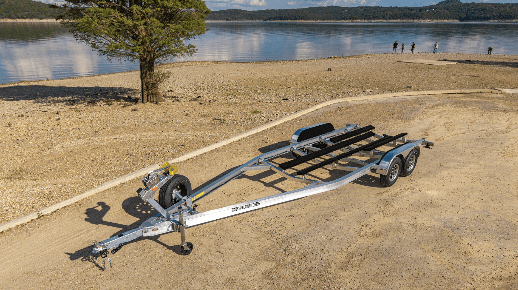 EZ Loader custom tandem axle aluminum pontoon trailer with integrated boarding ladder, marine-grade bunks, and corrosion-resistant frame built for lightweight, long-lasting performance.